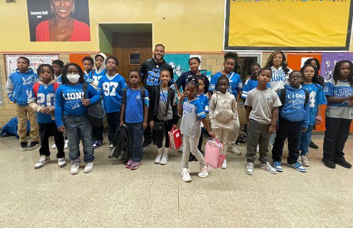  students dressed in detroit lions jerseys and tee shirts